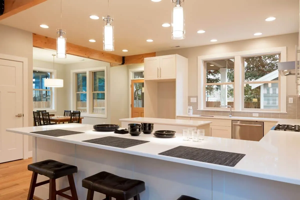 A kitchen painted in neutral tones and staged for sale